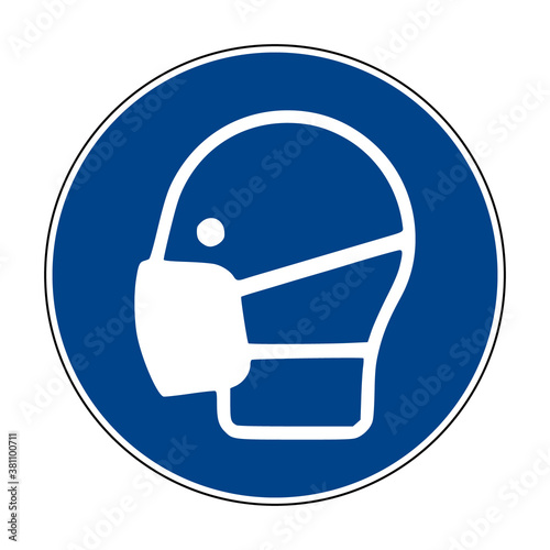 Wear face mask symbol. Wear respiratory protection mandatory sign. Vector illustration of circular blue sign with face with mask icon inside. Face shield. ISO 7010 - M016. photo