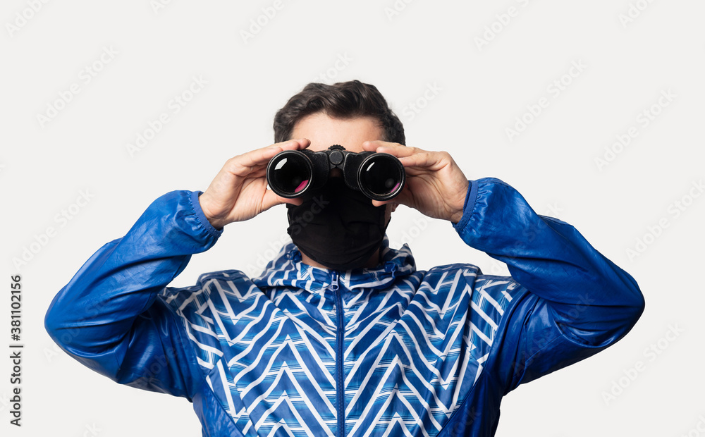 Style guy in face mask with binoculars Style guy in face mask with binoculars