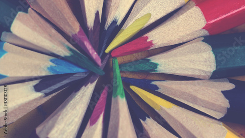 Set of colored pencils folded in a circle photo