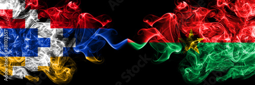 Nagorno-Karabakh  Artsakh vs Burkina Faso smoky mystic flags placed side by side. Thick colored silky abstract smoke flags