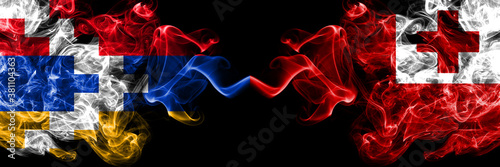 Nagorno-Karabakh  Artsakh vs Tonga  Tongan smoky mystic flags placed side by side. Thick colored silky abstract smoke flags