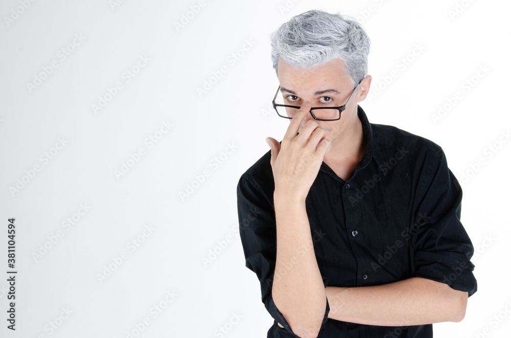 Headache and stress. Young attractive guy. Grey background. Headache and stress. Young attractive guy. Grey background.