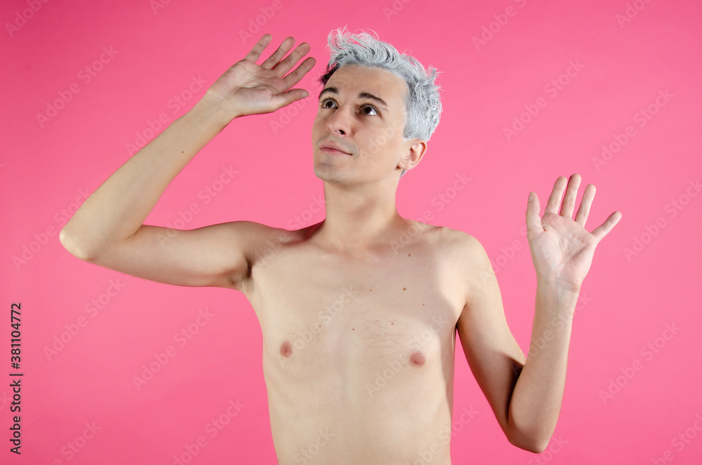 Young attractive guy. Pink background. Young attractive guy. Pink background.
