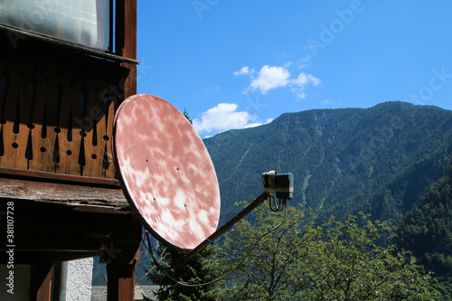 The detail of the old shabby satellite dish with rust on it. It is an illustration of old technology. 