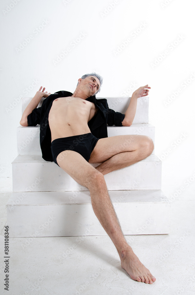 Young attractive guy. Grey background. Young attractive guy. Grey background.