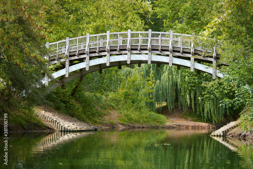 Holzbrücke zur Marieninsel im Rotehornpark in Magdeburg photo