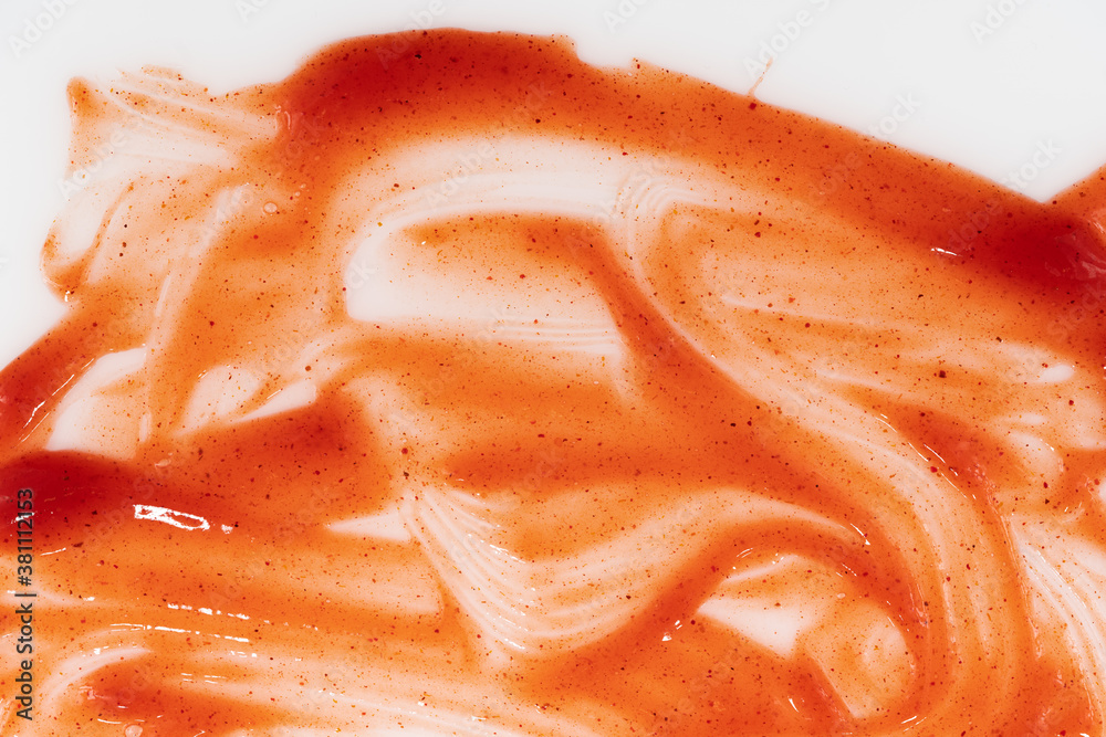 Tomato ketchup sauce  on a white background. Spots and stripes ketchup texture
