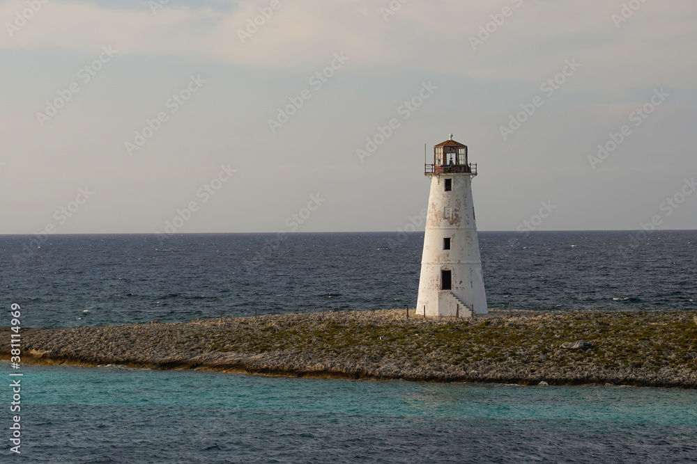 Amazing lighthouse at the reef of Nassau Bahamas on the calm, or wavy sea.