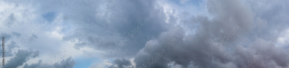 Panorama of grey high layered grey epic clouds on sky. Heaven cloudscape air view