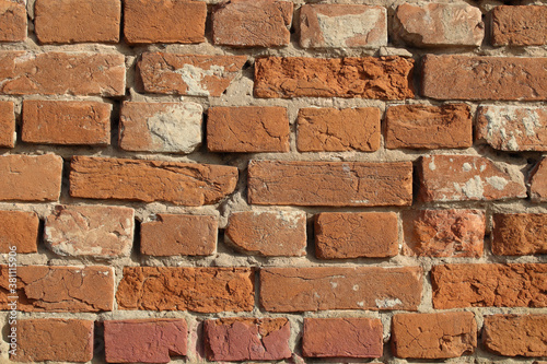 Old red brick wall. Close-up. Background. Texture.
