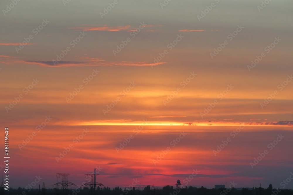 Beautiful fiery red sunset over the city, natural sky background Beautiful fiery red sunset over the city, natural sky background