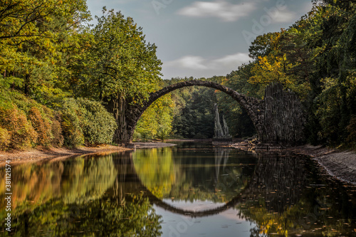 Ancient stone bridge in water reflection © Ondra