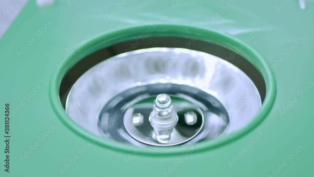Close up shot of blood samples spinning in centrifuge during