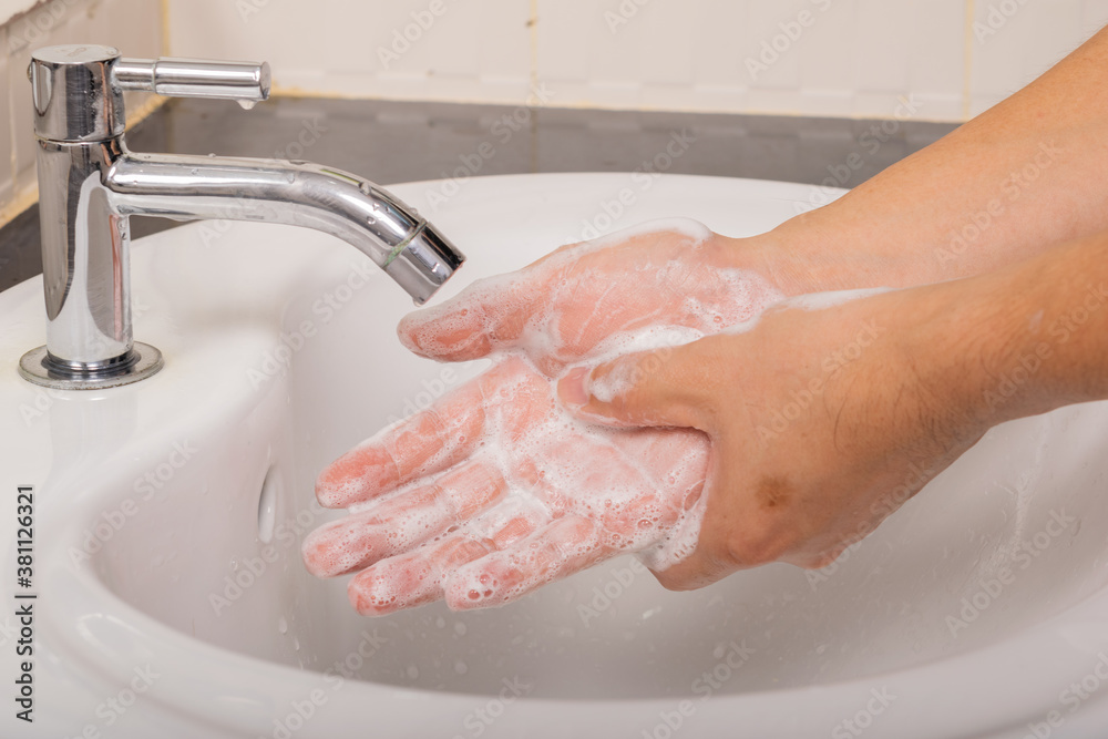 Man washes his hands with soap at home before and after do activity to prevent coronavirus (COVID-19).Hygiene concept. Man washes his hands with soap at home before and after do activity to prevent coronavirus (COVID-19).Hygiene concept.