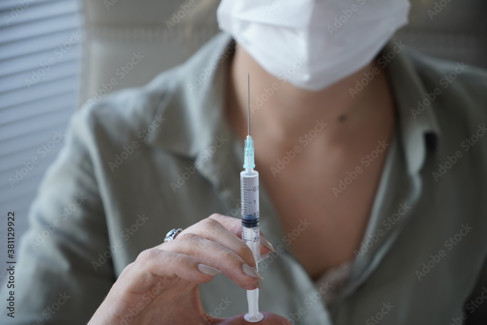 Syringe, medical injection in hand, palm or fingers. Medicine plastic vaccination equipment with needle. Nurse or doctor. Liquid drug or narcotic. Health care in hospital. Syringe, medical injection in hand, palm or fingers. Medicine plastic vaccination equipment with needle. Nurse or doctor. Liquid drug or narcotic. Health care in hospital.