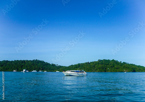 Boats and yachts are waiting for tourists for sea trips on a sunny day.