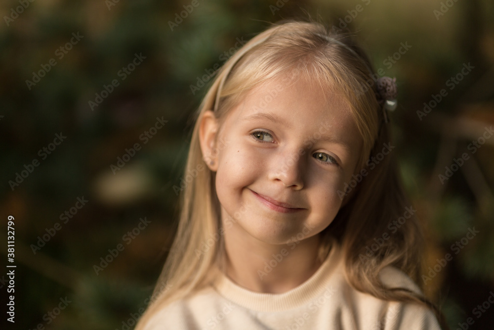 Cute stylish little girl with long blonde hair walking in autumn park. Autumn kids fashion. Happy childhood. Lifestyle portrait. Caucasian child 6 years old outdoor Cute stylish little girl with long blonde hair walking in autumn park. Autumn kids fashion. Happy childhood. Lifestyle portrait. Caucasian child 6 years old outdoor