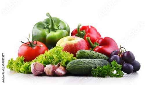 Composition with fresh vegetables and fruits isolated on white