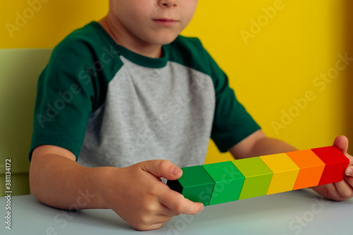 Bilde på lerret close up of kind hands holding colored cubes in line