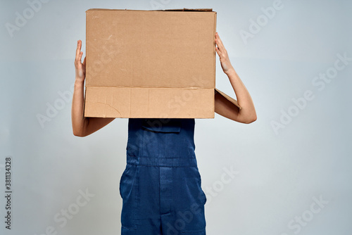 Woman in working uniform box packing service lifestyle © SHOTPRIME STUDIO
