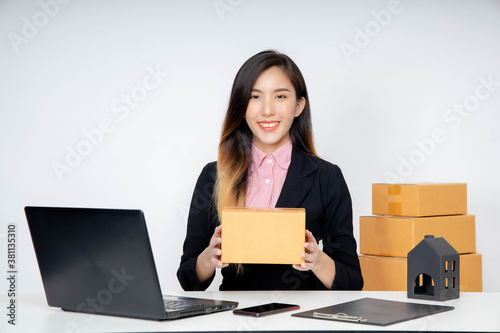 Asian woman entrepreneur/ Business owner working at home for online shopping