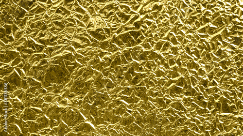 gold foil background with shiny crumpled surface for texture background