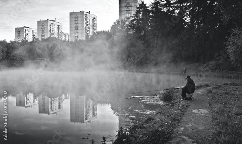 fisherman in the morning fog