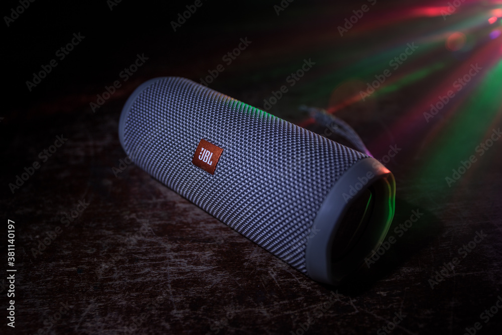 BAKU. AZERBAİJAN – 28.07.2020: JBL Flip 4 Bluetooth Speaker close up shot  on wooden table with colorful lights and fog on background. Stock Photo |  Adobe Stock