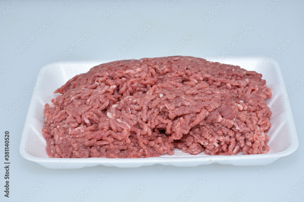 fresh organic mutton mince meat decorated in plate on white background fresh organic mutton mince meat decorated in plate on white background