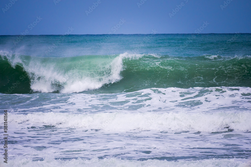 Powerful blue ocean wave with perfect breaking natural background