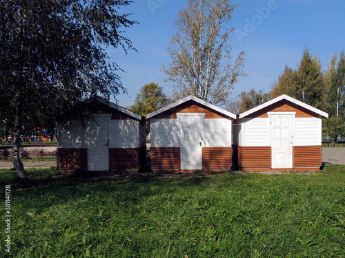 Three wooden houses in a Park in Tutaev, Russia.