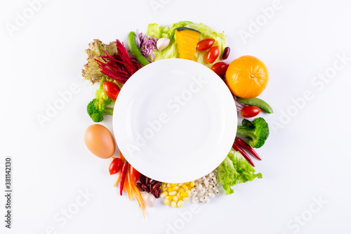 World food day, vegetarian day, Vegan day concept. Top view of fresh vegetables, fruit, with empty plate on white paper background.