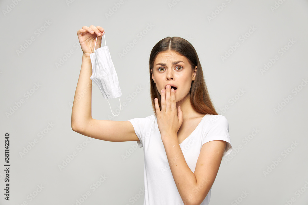 Portrait of a woman Covering his mouth with a medical mask safety Portrait of a woman Covering his mouth with a medical mask safety