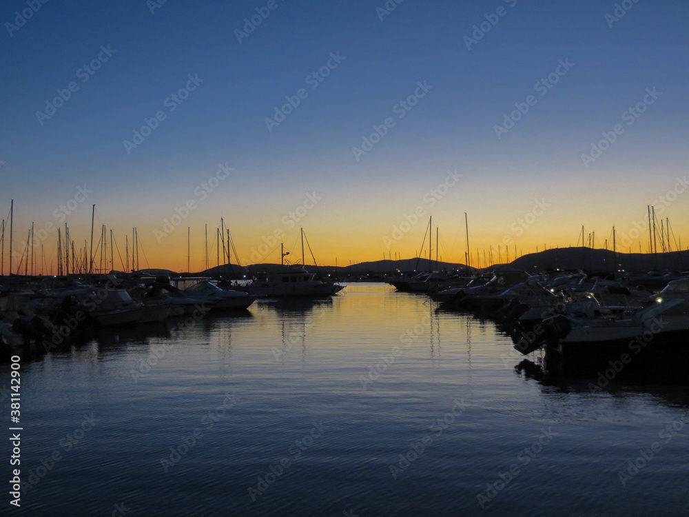 a beautiful sunset in a small port of Sardignia