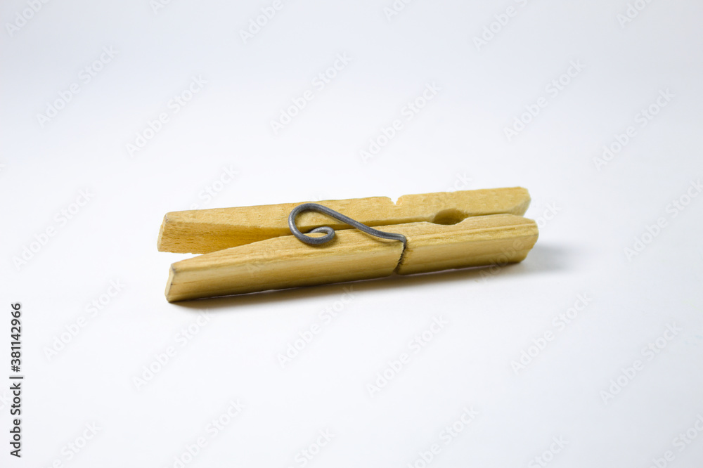 Clothespin made of wood on a white background Clothespin made of wood on a white background
