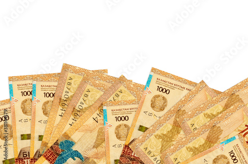 1000 Kazakhstani tenge bills lies on bottom side of screen isolated on white background with copy space. Background banner template photo