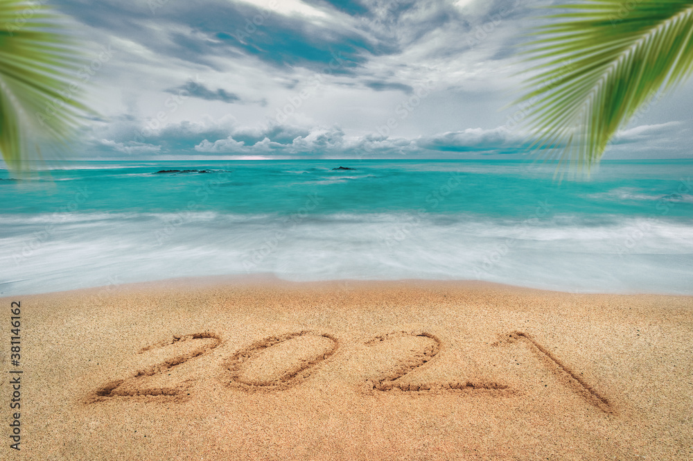 Happy New Year 2021, lettering on the beach with wave and blue sea. Numbers 2021 year on the sea shore, New Years concept. Happy New Year 2021, lettering on the beach with wave and blue sea. Numbers 2021 year on the sea shore, New Years concept.