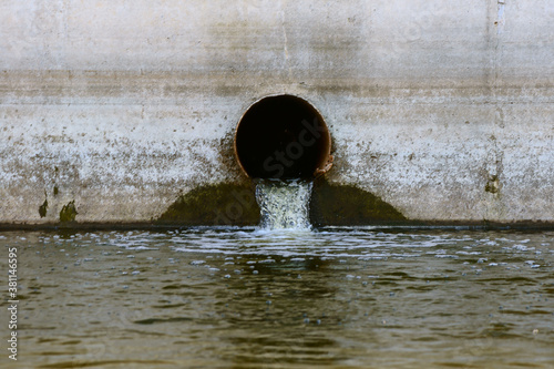 Rusty sewer pipe with water leaking into the reservoir