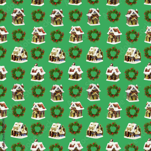 A seamless pattern, Christmas houses and wreaths of spruce branches on a light green background. © Алексей Кочев