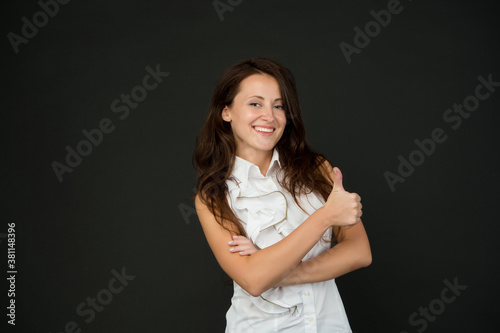 happy businesswoman show thumb up. successful woman in white shirt. business success. confident cheerful girl giving thumb up gesture. good approval. lady in formalwear. Approving expression