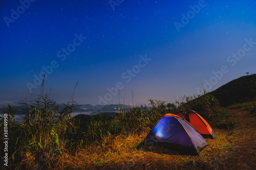 Khao Chang Phueak Mountain at night time with camping tents