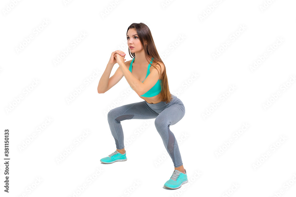 Woman in sportswear doing exercises on the body warm up jogging
