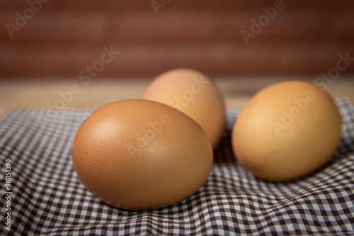 fresh chicken eggs on a old wooden table