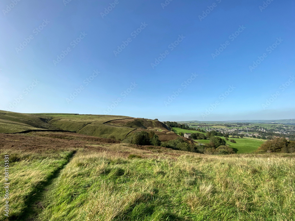 Moorland, high on the hills, with fields and meadows, in the distance near, Ripponden, Halifax, UK Moorland, high on the hills, with fields and meadows, in the distance near, Ripponden, Halifax, UK
