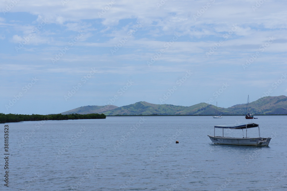 Boat on the roadstead in the bay near the town of Nadi on the island of Viti Levu in the archipelago of Fiji Boat on the roadstead in the bay near the town of Nadi on the island of Viti Levu in the archipelago of Fiji