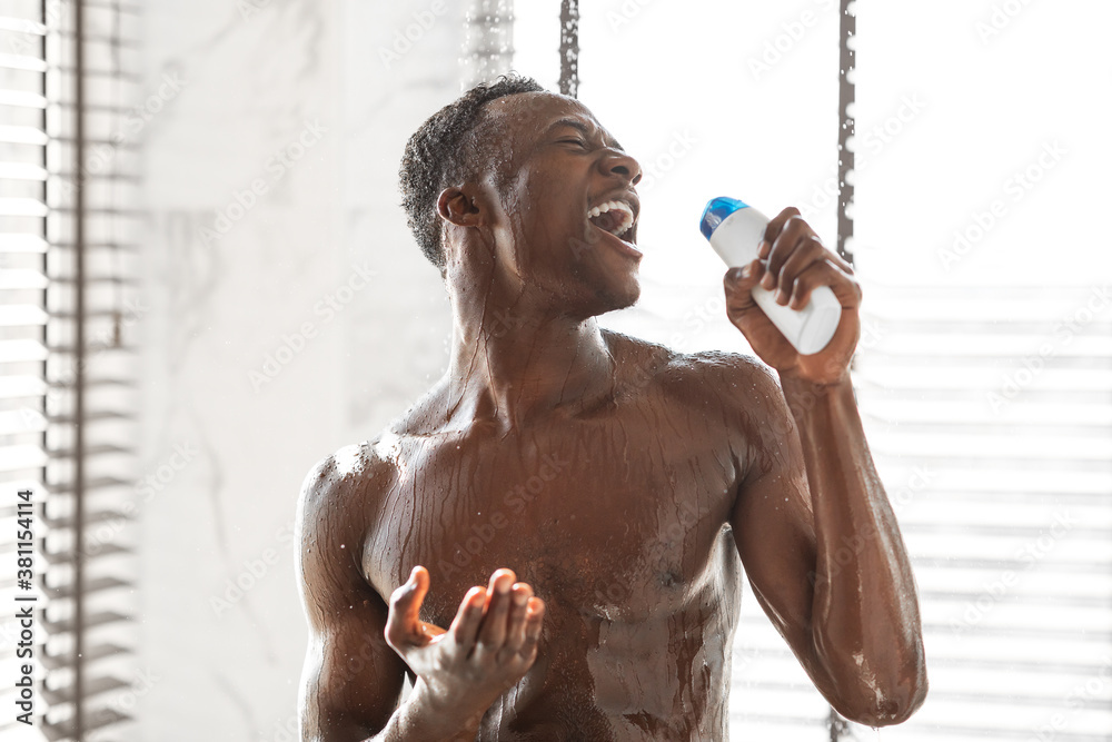 Naked African Man Singing Holding Shampoo Bottle Taking Shower Indoors