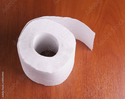 toilet paper roll on wood background