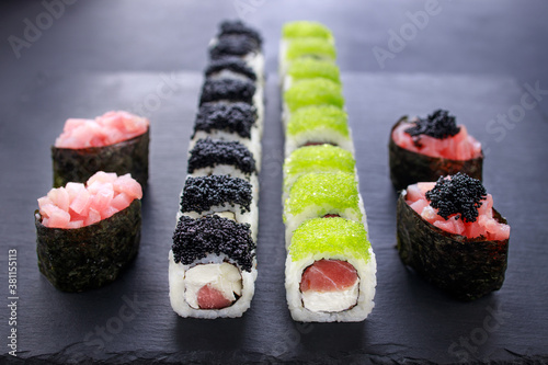 gunkan and maki sushi set decorated with caviar