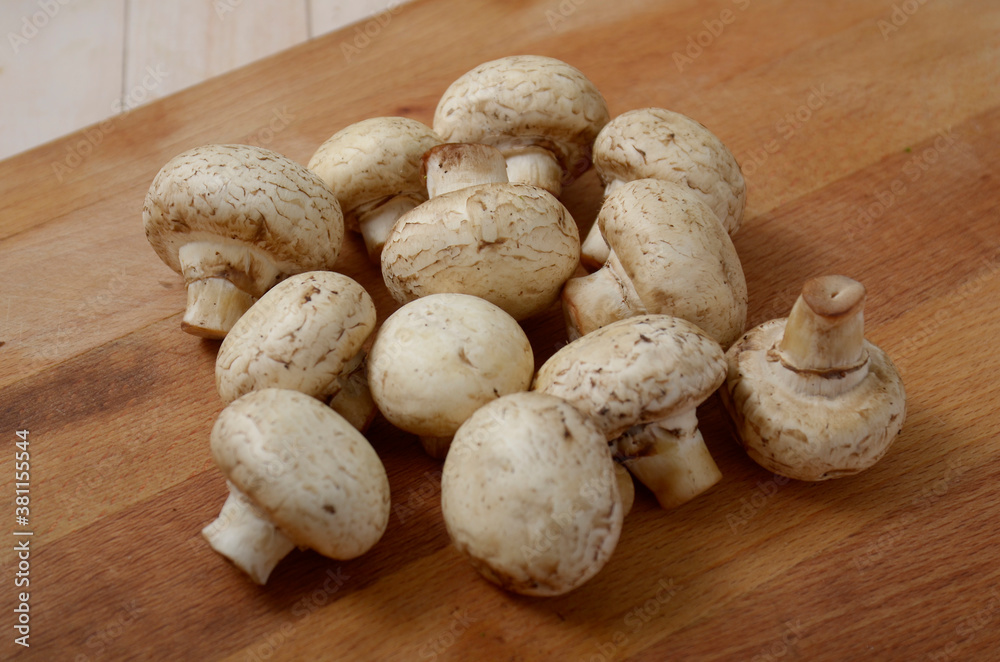mushrooms on a wooden table mushrooms on a wooden table