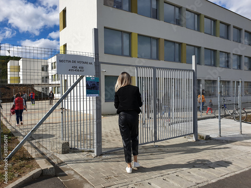 Girl entering to vote on local elections Romania